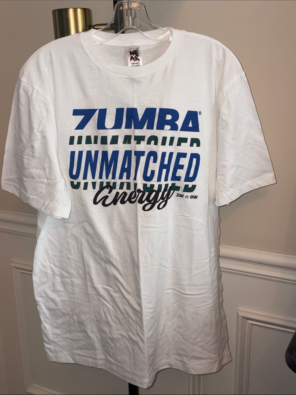 NWOT Zumba Fitness White Tee with Blue, Green Black Graphic one size fits all
